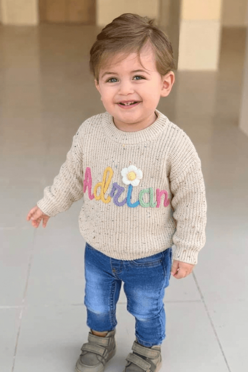 Child wearing a personalized handmade sweater
